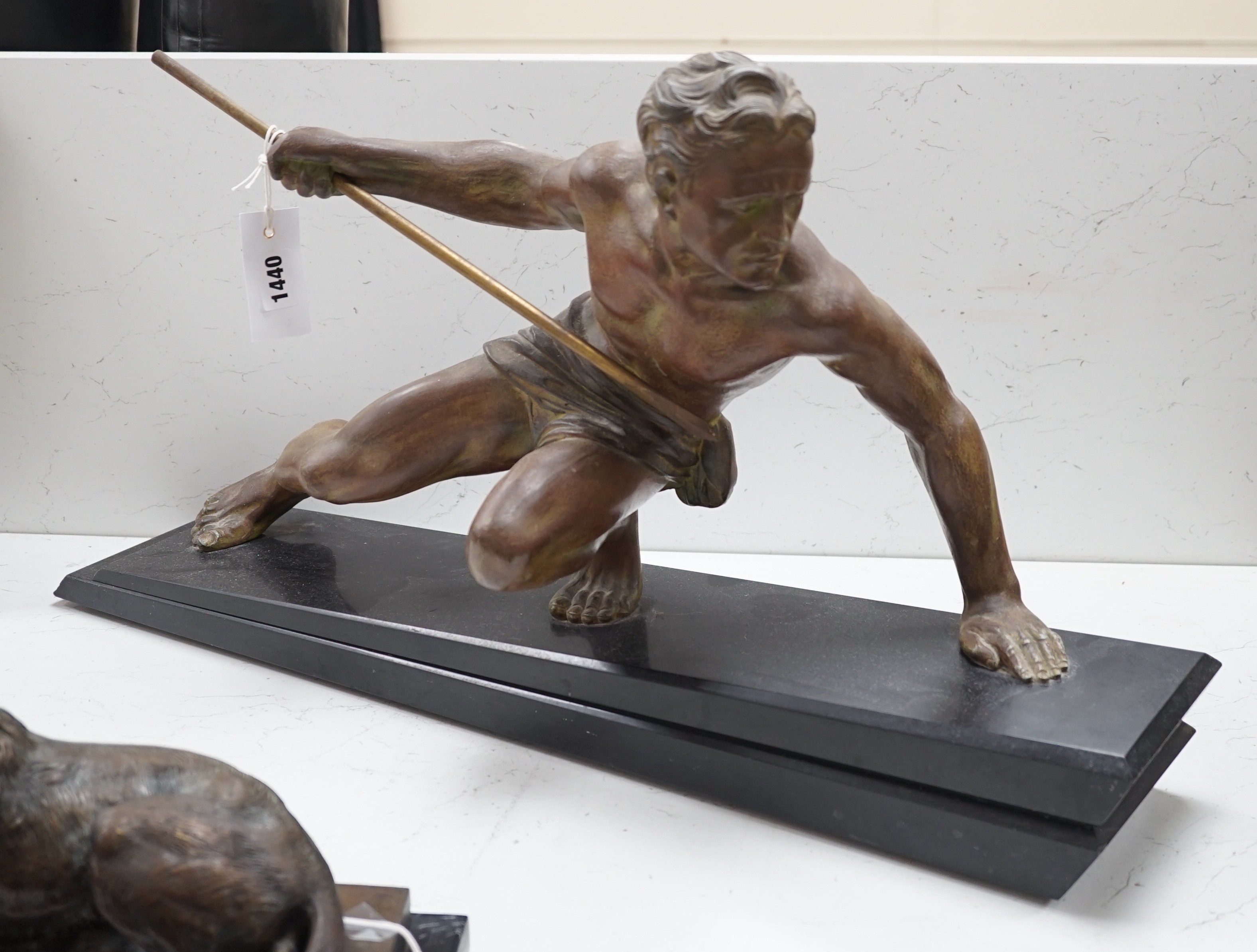 A patinated spelter hunter, on slate plinth, 72cm long